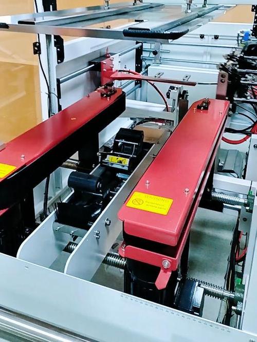 自动开箱机、自动折盖封箱打包一体机与纸箱开箱机 现代包装流水线的核心装备